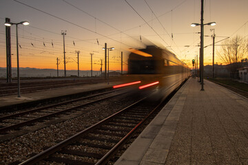 Train starting the journey at Mangualde station in Viseu district during sunset