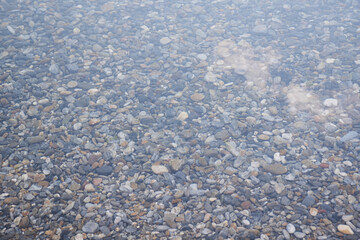 Clean water of Lake Baikal. Transparent water and stones on the bottom