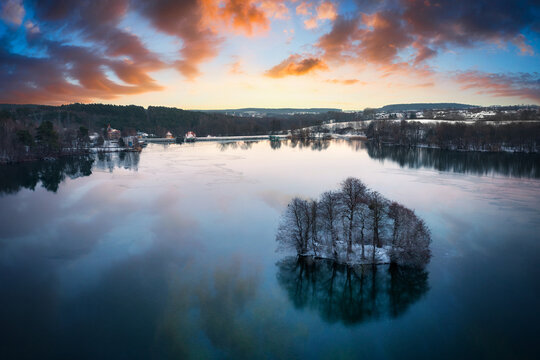 Aerial landscape of a wintery lake at sunset. Poland