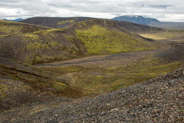 Fototapeta na wymiar Volcanic landscape in Iceland. Lava flows with green moss