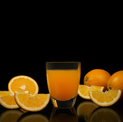 orange juice on black background