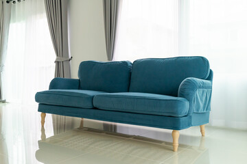 Fototapeta na wymiar Blue sofa in living room interior home background