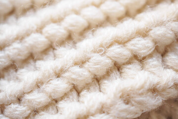 closeup beige knitted woolen fabric texture background