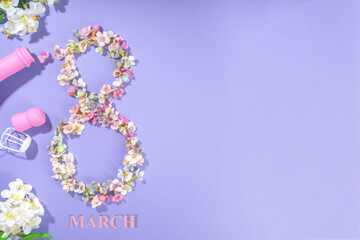 8 march spring holiday background with 8 march made with spring blossom flowers, pink colored champagne bottle, on violet very peri color background flatlay copy space