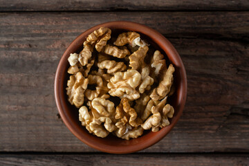 A bowl of walnut grains. View from above.