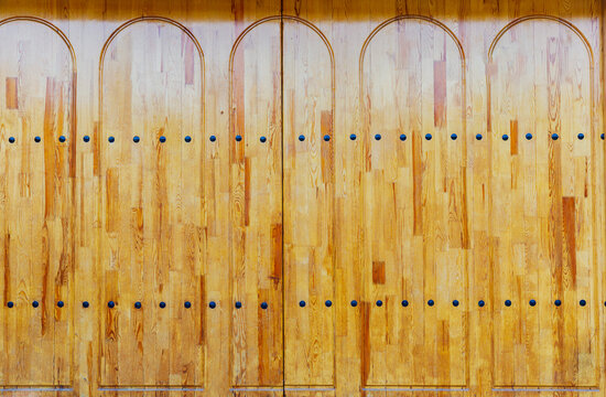 Wooden planks gate texture with iron rivets