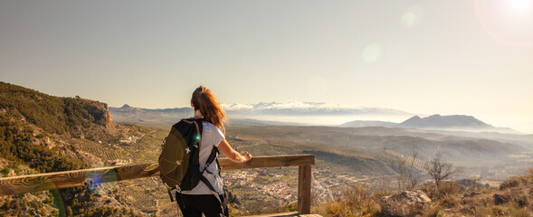 woman looking at panoramic view on Sierra nevada in Spain