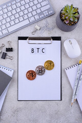 Bitcoin coins on office desk. Cryptocurrency concept