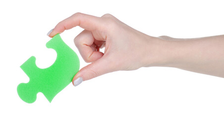 Green puzzle in hand puzzle in hand on white background isolation