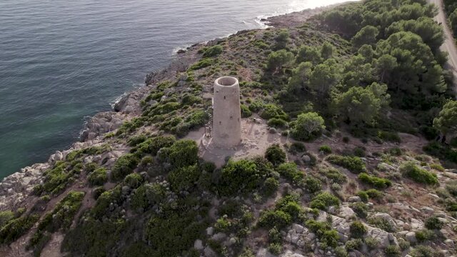 Aerial 4k footage of medieval coastal defensive tower of La Corda in Oropesa, Spain