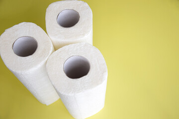 Absorbent paper napkin kitchen towels on yellow background.