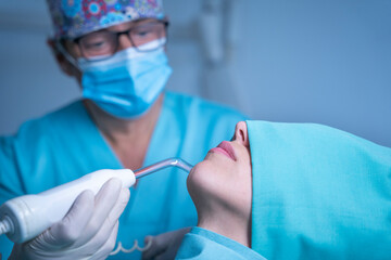 Dentist doing ozone dental treatment - obrazy, fototapety, plakaty