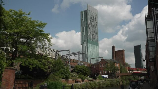 Train passing by and 301 Deansgate in background, Castlefield, Manchester, Lancashire