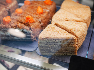 Carrot and honey cake. A beautiful cut of dessert on a plate.