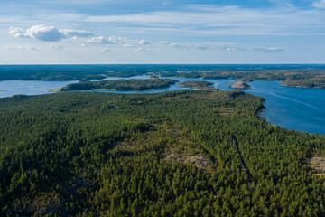 Aerial photography on Ladoga skerries. Ladoga Lake in Karelia in hot summer. Rocky wild islands in the middle of the lake. Russian nature