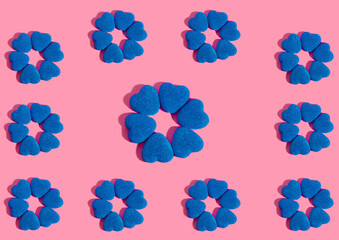 valentines candy blue hearts marmalade on a pink background pattern