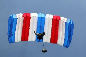 Skydiver in a blue sky