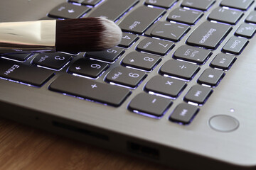 Laptop keyboard and dust cleaning brush, cleaning the keyboard from dust