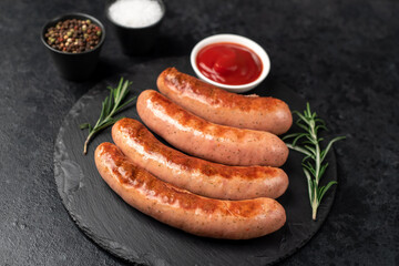 grilled sausages on a stone background