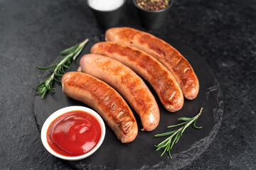 grilled sausages on a stone background