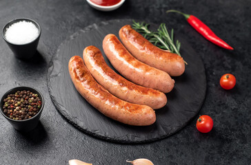 grilled sausages on a stone background