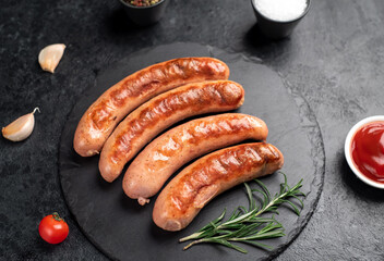 grilled sausages on a stone background