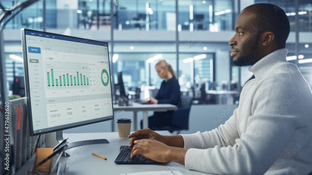 Poster corporate office: handsome black it specialist using desktop computer with big data statistics, grap