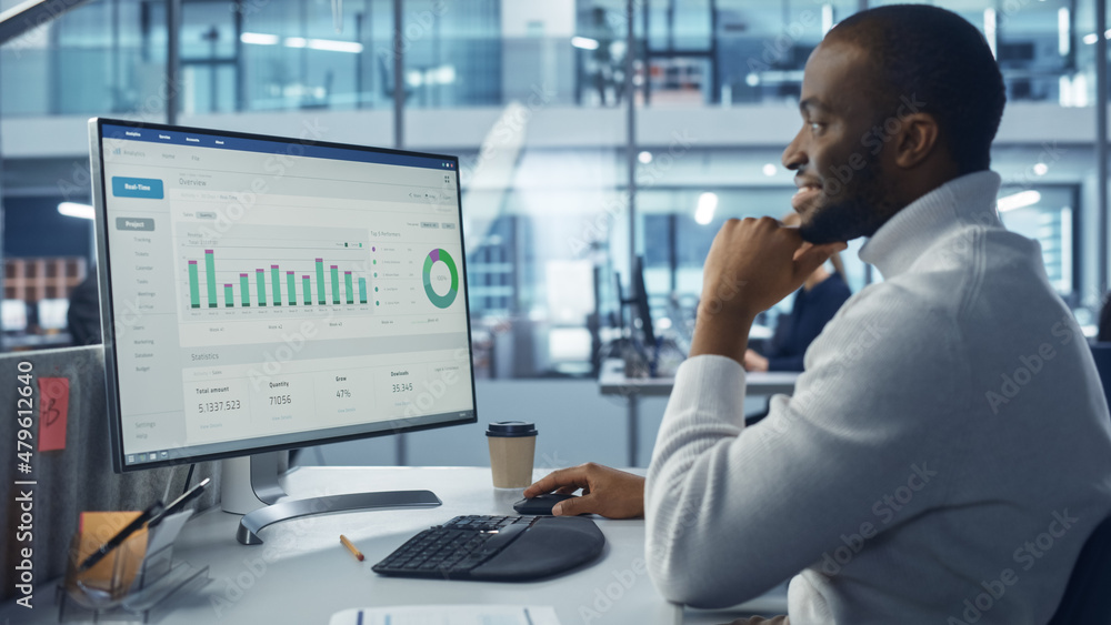 Poster Corporate Office: Handsome Black IT Specialist Using Desktop Computer with Big Data Statistics, Graphs. Creative Software Engineer Work on eCommerce Project Marketing, Development.