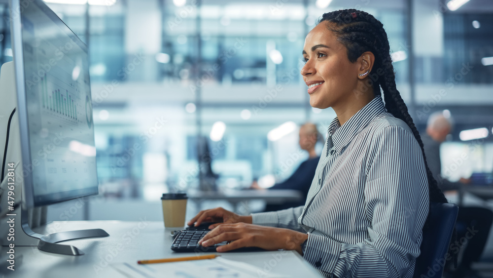 Poster corporate office: black female it technician using desktop computer, uses big data statistics, graph