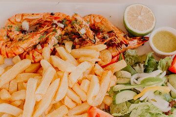 Plate with good served cooked meal in restaurant.