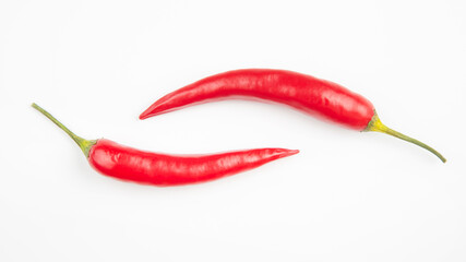 Red hot chili peppers on a white background. Vitamin vegetable food