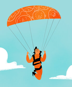 Person in the sky with face patterned parachute
