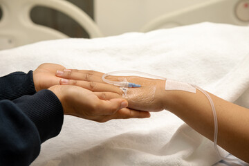 Fototapeta premium Elder senior hold woman patient hand sleeping on bed in hospital room. Health care medical concept