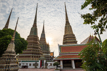 Fototapeta premium Wat Pho, also spelled Wat Po, a famous Buddhist temple complex in Bangkok, Thailand. Popular for tourists and it is also known as Temple of the Reclining Buddha. 