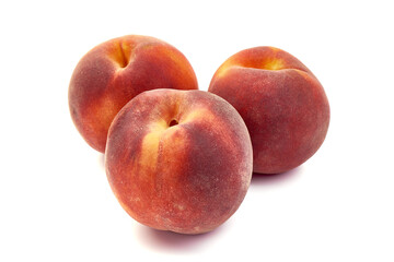Fresh peaches, isolated on white background.