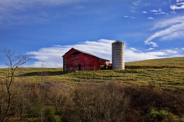 Old Barn on a HIll with Vibrant Blue Sky