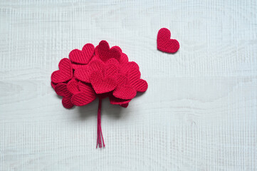 Knitted Love hearts on a grey background, valentines day post card concept.