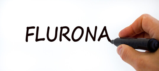 New covid-19 flurona variant strain and flu corona symbol. Doctor hand with black marker. The concept word Flurona. Medical and COVID-19 flurona variant strain and flu corona concept. Copy space.