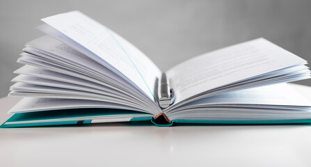 Open paper book with pages of business knowledge.