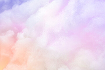 Colorful pastel fluffy cotton candy, clouds background, soft color sweet candyfloss, abstract high resolution texture. Sky background. Soft sunset clouds. Watercolor purple, pink, yellow backdrop. 