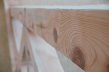 Sanding wood. wood texture. Sanded wooden beams. Close-up view. Sanding a wooden beam at a construction site