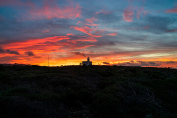 Obraz premium Sunset on the Capo Ferro lighthouse, Porto Cervo, - Sardinia