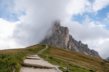 Cloudy Dolomites Gusela mountain, Passo di Giau with peak Ra Gusela. Location place Dolomiti Alps, Cortina d'Ampezzo, South Tyrol, Italy, Europe.