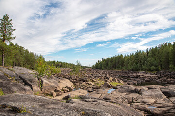 Stone River. Summer landscape of a river with rocks and forest in Belomorsk, Karelia, Russia. Panorama view