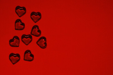 Glass little hearts on a colored background. Valentine's Day Greeting Card