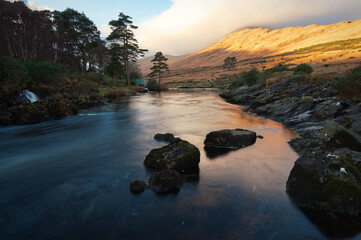 Beautiful sunrise landscape scenery of mountain reflected in river Erriff at Aesleagh in county...