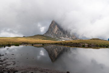 Dramatic mirror image in the water of the peak Ra Gusela in Passo di Giau. Dolomiti Alps, Cortina d'Ampezzo location, South Tyrol, Italy, Europe.