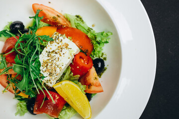 The delicious new salad is made in the white bowl.