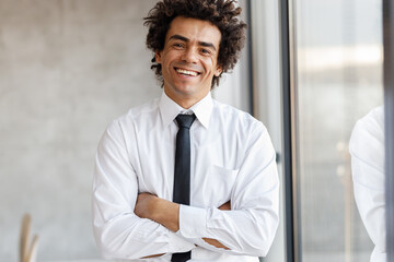 Fototapeta premium Corporate portrait of successful young black businessman at the office.