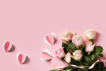 Flat lay with roses on pink background, valentines day and mothers day concept